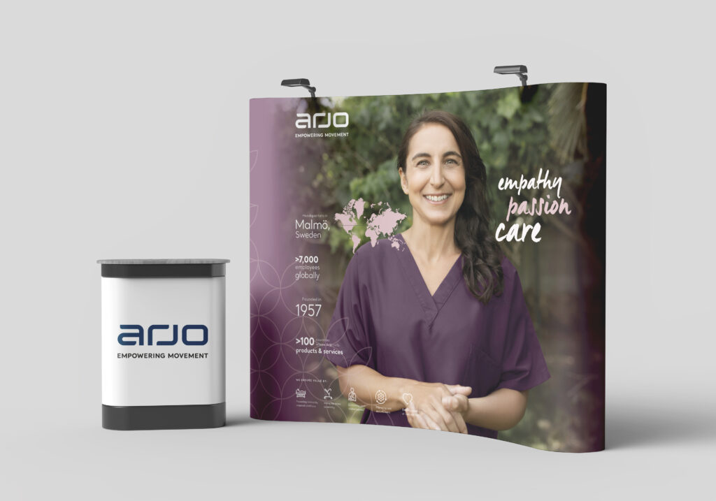 Arjo 2026 exhibition wall with counter